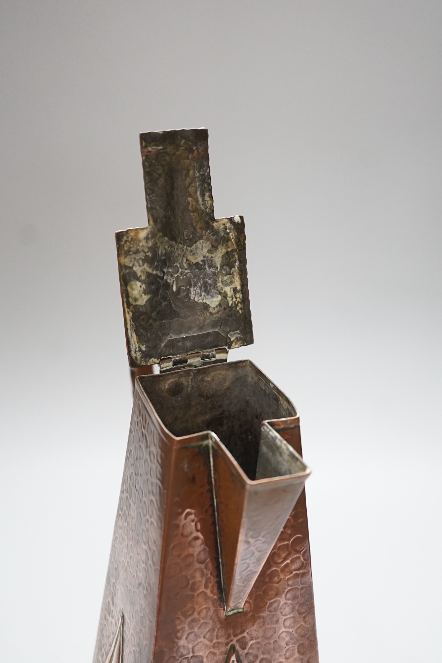 A hammered copper Art Nouveau coffee pot, 29cms high